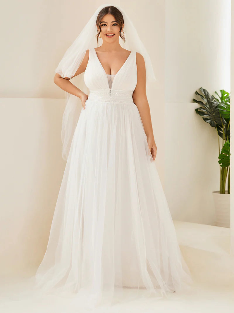 Ivory plus size wedding dress with deep v neck tulle skirt beaded detail.